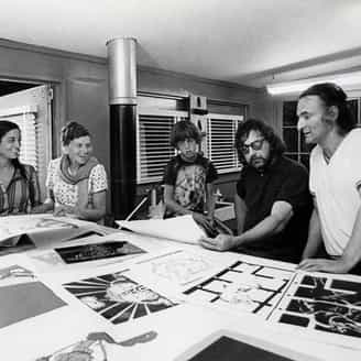 Larry Rivers, Terry Southern and his son, Nile, Tatyana Grosman, and Marisol looking at early proofs of the Rivers/Southern collaboration, The Donkey and the Darling. 